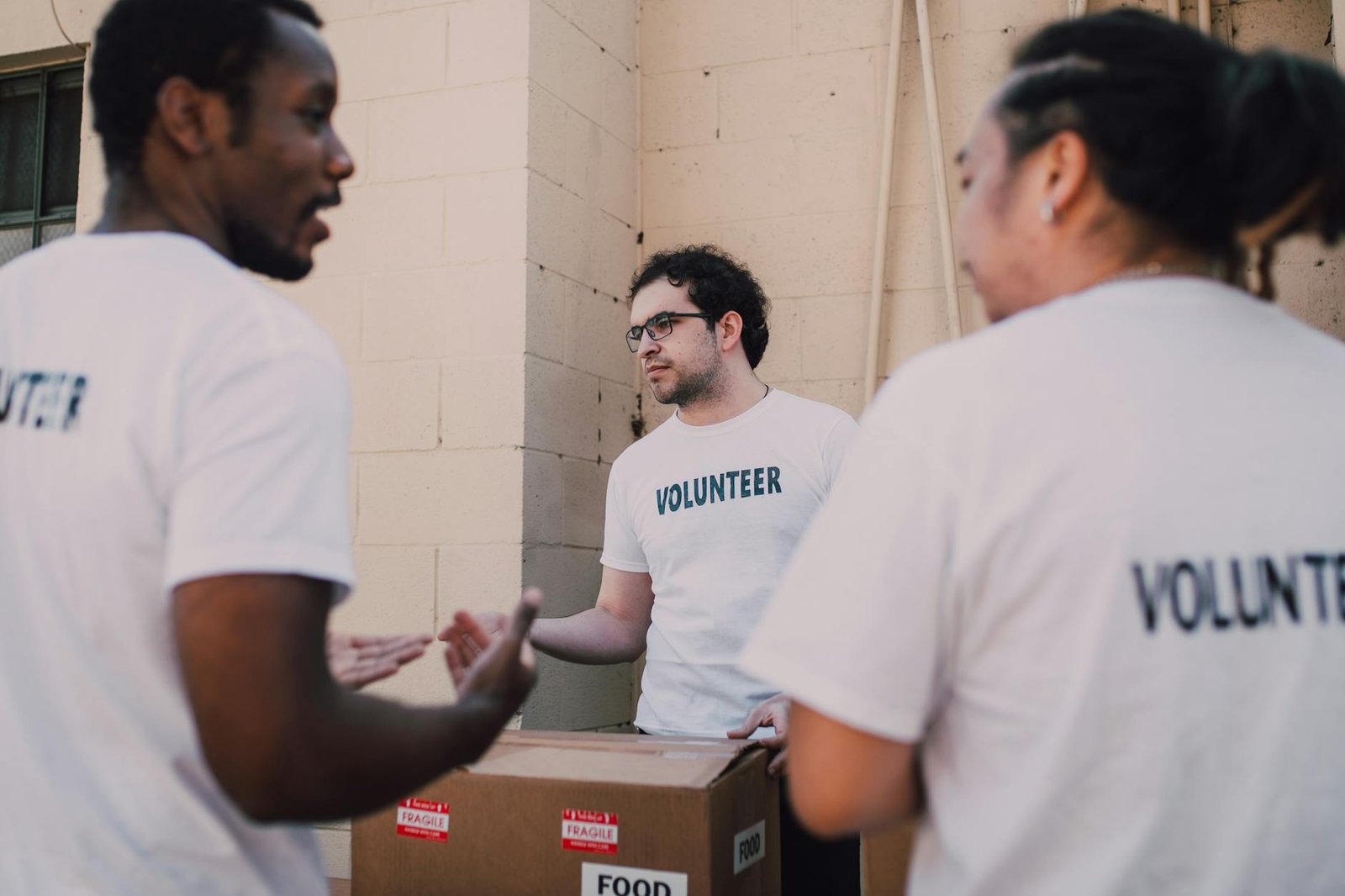 A group of volunteers organizing donation supplies together